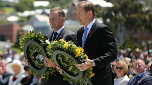 New Zealand Prime Minister John Key and Australian Prime Minister Tony Abbott lay wreaths at an Anzac ceremony. (AAP)