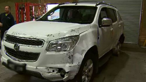 Police are still searching for the driver who rammed into two unmarked police cars. (9NEWS)