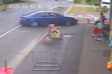 Car skids out of control, pinning teenagers to wall