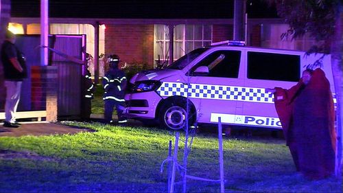 The occupants of the house were not injured but police were taken to hospital. Image: 9News