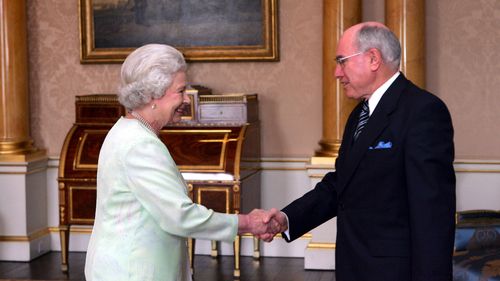 Former Prime Minister John Howard has an audience with Her Majesty The Queen at Buckingham Palace in 2005.