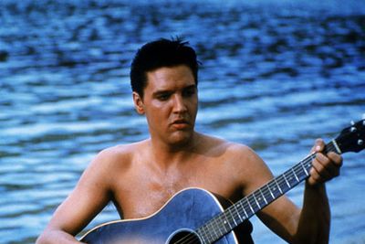 Elvis plays an ex-soldier-turned tour guide in this cheesy classic - now that's one guy we'd <i>love</i> to have show us around Hawaii!