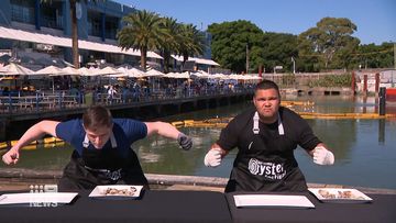 World champion and Australian champion oyster shuckers go head to head at Sydney fish market.