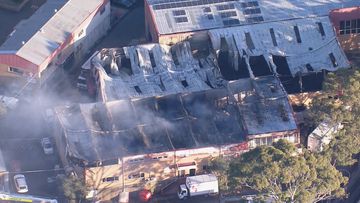 Police are investigating after the fire broke out in multiple units on Old Pittwater Road in Brookvale just after 7pm on July 10.