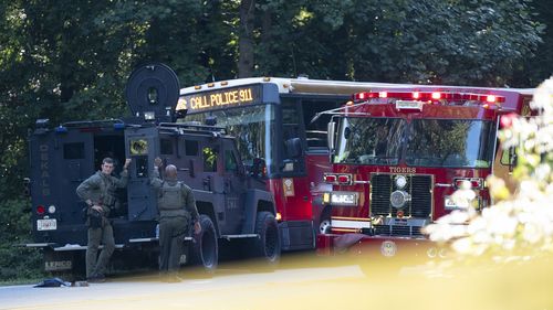 News photos showed an armored police SWAT vehicle squarely blocking the front of the bus, which was also flanked by a firetruck. 