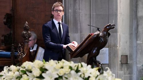 British actor Eddie Redmayne reads a remark during the funeral. (EPA)