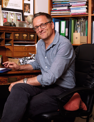 Dr Michael Mosley sitting in an office