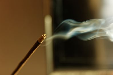 Burning aroma incense stick with smoke. Aromatherapy