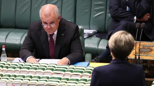 Scott Morrison listens to a question from Tanya Plibersek.