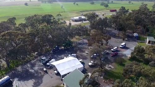 Residents arrive for a test at a COVID-19 testing site.