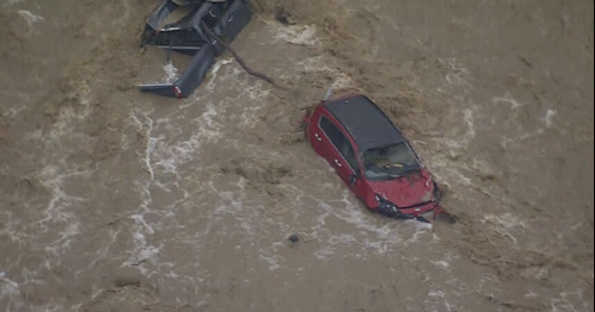 One rescued, dozens of cars swallowed by flash flooding at Victorian holiday hotspot