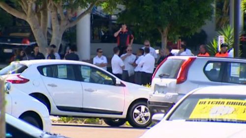 Staff at the car yard were repeatedly evacuated while the Bomb Squad evaluated the threat. (9NEWS)
