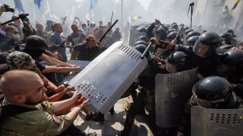 Ukraine's capital reels as clashes kill two policemen