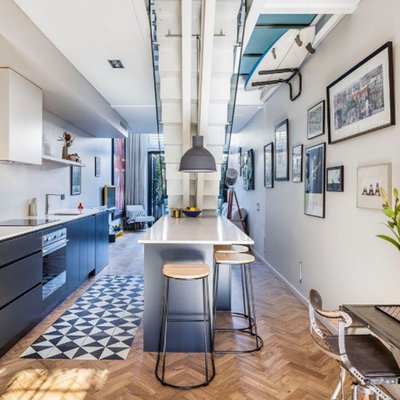 Sydney terrace makes incredible use of its tiny floorplan with a ‘floating staircase’ above the kitchen bench