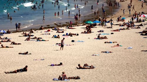 Sydney is having its hottest April day on record, with temperatures hitting 34C in the city