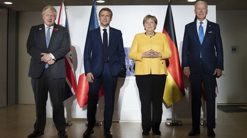 From left: British Prime Minister Boris Johnson, French President Emmanuel Macron, German Chancellor Angela Merkel and U.S. President Joe Biden at the G20 summit in Rome. 