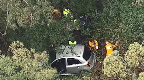 A woman has been rescued from her car after it crashed down an embankment on the Gold Coast hinterland. (9NEWS)