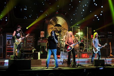 Tom Scholz, Kimberley Dahme, Jeff Neal, David Victor and Tommy DeCarlo of Boston perform at Hard Rock Live! in the Seminole Hard Rock Hotel & Casino on June 5, 2014 in Hollywood, Florida.