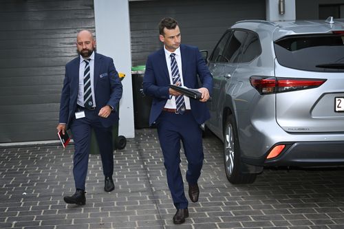 Detectives depart after executing a search warrant at the Bankstown home of one of the nurses in the alleged antisemitic video.