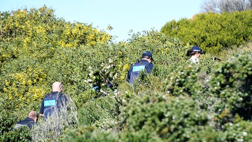 Police are seen at the home of Kings Cross club owner John Ibrahim during a police operation in Sydney, Tuesday, August 8, 2017. (AAP)