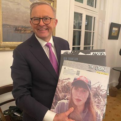Anthony Albanese holds a handful of records gifted to him by New Zealand Prime Minister Jacinda Ardern.