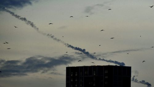 Missiles contrails are seen in the sky over Kyiv on December 29, 2022 amid the Russian invasion of Ukraine.