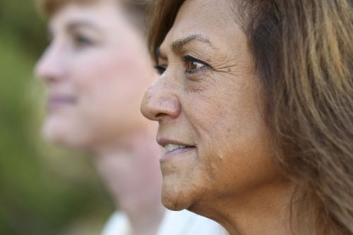 Leilani Lutali, foreground, recently found out her hospital wouldn't approve her kidney transplant surgery until she got the COVID-19 vaccine. (AP Photo/Thomas Peipert)