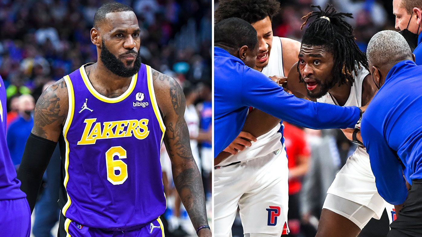 Isaiah Stewart of the Detroit Pistons is restrained after receiving a blow to the face by LeBron James 