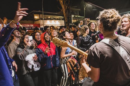 Crowds of people inundated the streets of Byron Bay after Splendour in the Grass festival cancelled its first day due to bad weather. People waited in long queues to enter venues. Photo shows local band The Seeding entertaining crowds on the streets. The buskers played for eight hours to keep the swelling crowd amused. Friday July 22nd 