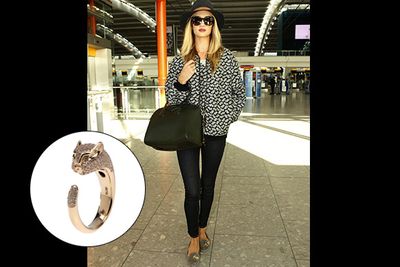 This ex-Victoria's Secret Angel may have had her wings clipped, but that hasn't stopped her from taking flight in stunning fashion.<br/><br/>She landed at LAX toting this $2000 Stella McCartney jacket and $2500 Givenchy bag. Oh, and on her teeny pinky finger? A $6250 Anito Ko panther ring. Rosie, your style slays us.