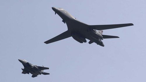 A B1 bomber accompanied by a South Korean fighter jet. (AP)