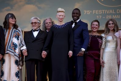 Margaret Sixel, from left, director George Miller, Doug Mitchell, Tilda Swinton, Idris Elba, Augusta Gore and Zerrin Tekindor pose for photographers upon arrival at the premiere of the film 'Three Thousand Years of Longing' at the 75th International Film Festival, Cannes, South of France, Friday 20 May 2022.