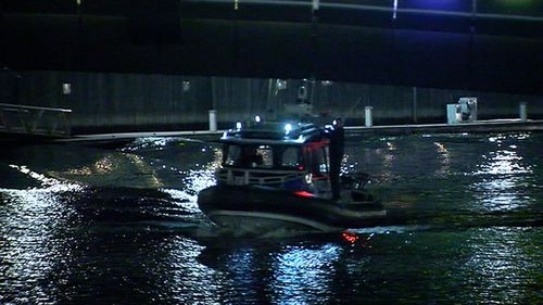 Two boys were seen standing on a boat as it drifted down the river. Picture: 9NEWS