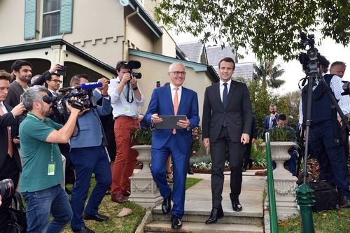 President Macron and Mr Turnbull head to the lecterns for the joint press conference. Picture: AAP