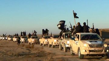 Image posted on a militant website shows a convoy of vehicles and fighters from ISIL fighters in Iraq's Anbar Province. Source: AAP