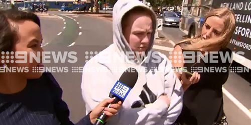 The 21-year-old mum (centre) will face court on April 30. (9NEWS)