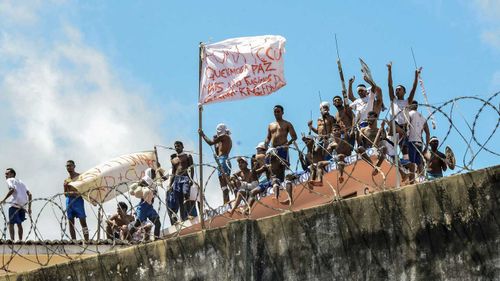 Inmates riot on the roof of a prison in Natal, Brazil. (AAP)