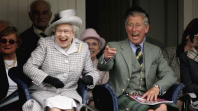 Her Majesty and King Charles watch competitors during the Braemar Gathering in Scotland in 2006.