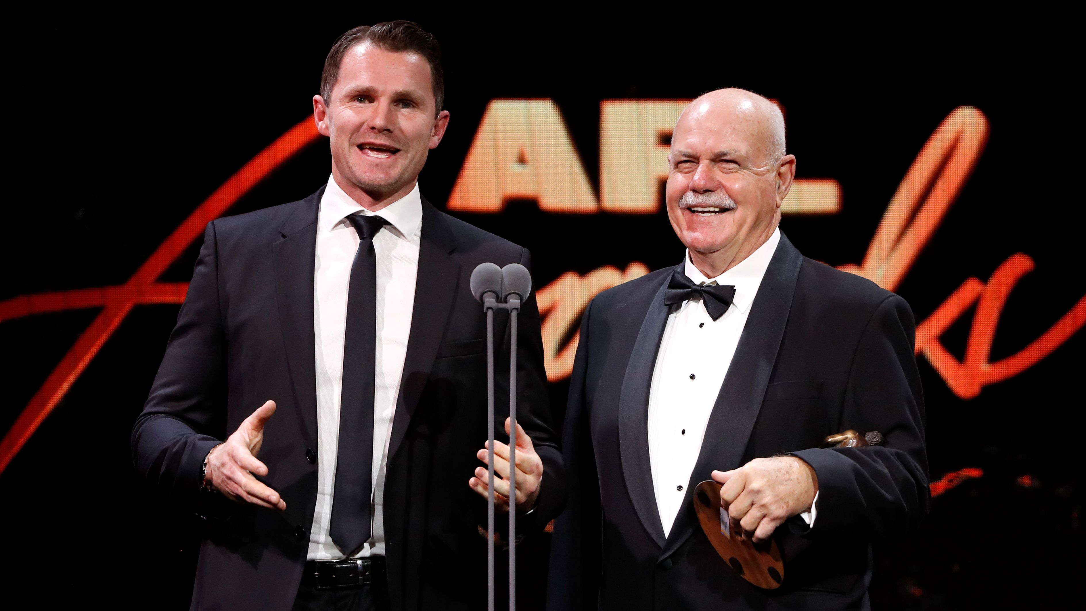 Leigh Matthews and Patrick Dangerfield present at the AFL Awards 2022.