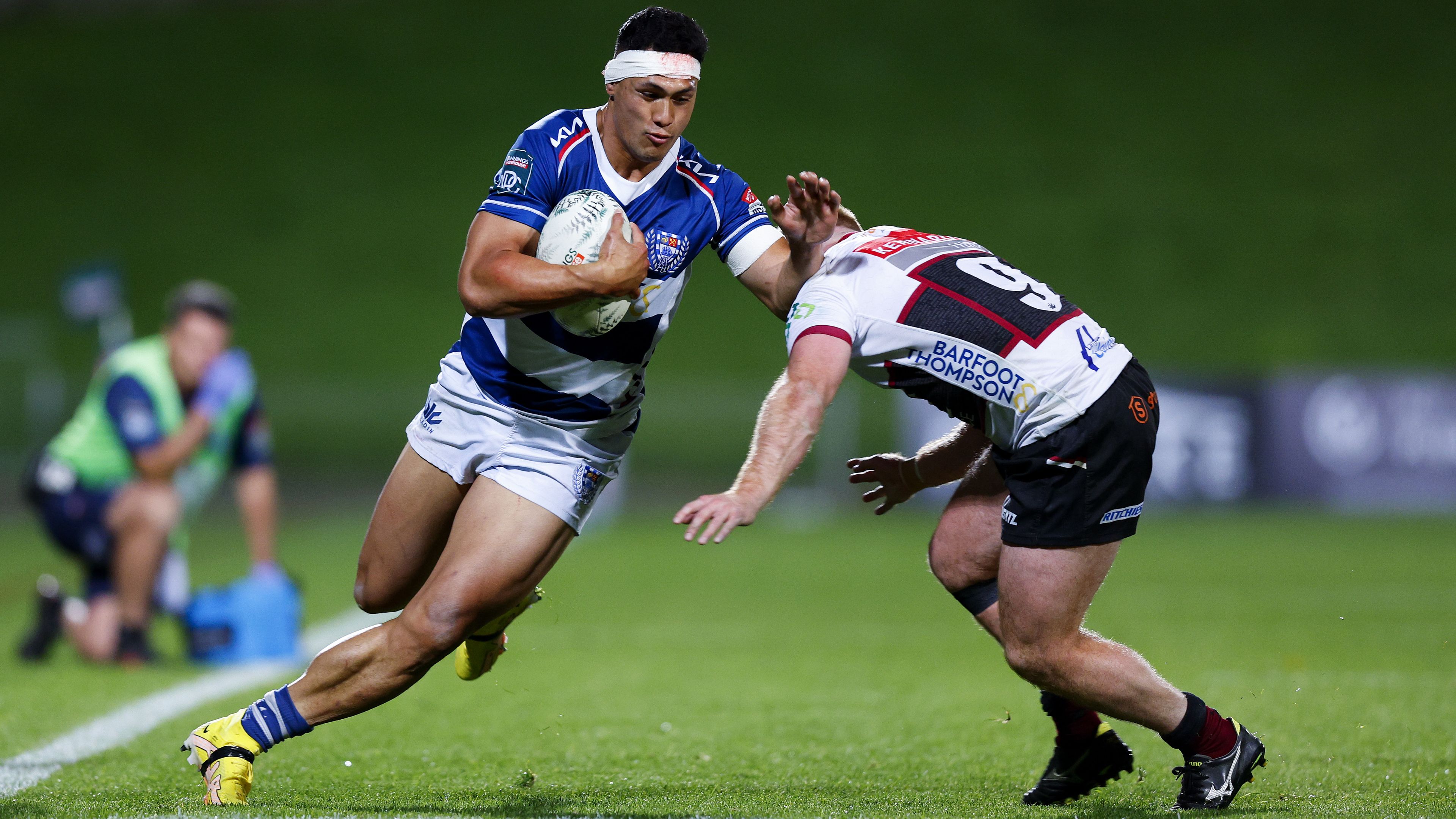 Roger Tuivasa-Sheck of Auckland is tackled by Jamie Booth of North Harbour.