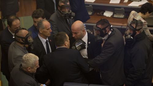 Police also entered the Kosovo parliament following the attack to extinguish the tear gas and force a small group of opposition lawmakers from the room. Picture: AAP.