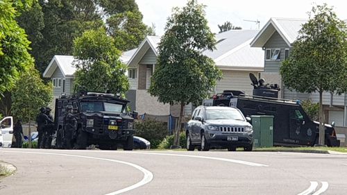 Third person arrested in attempted murder investigation, after police shut down suburban Newcastle street 