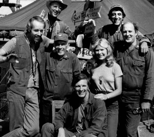 The cast members of MASH, from left: Mike Farrell, Bill Christopher, Harry Morgan, Alda, Loretta Swit, Jamie Farr and David Ogden Stiers. (AAP)