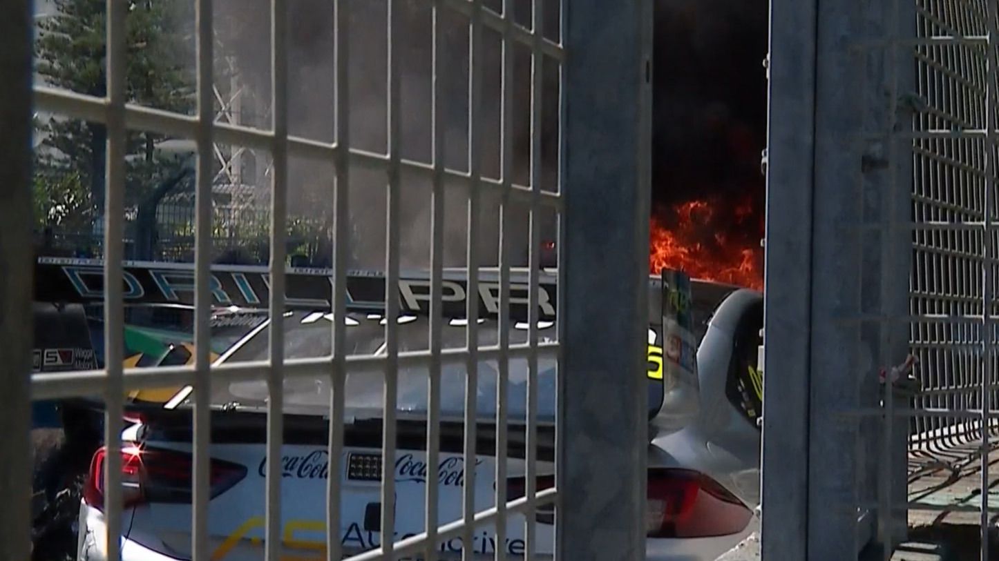 Drivers rush for fire extinguishers after Supercar bursts into flames in Gold Coast pile-up