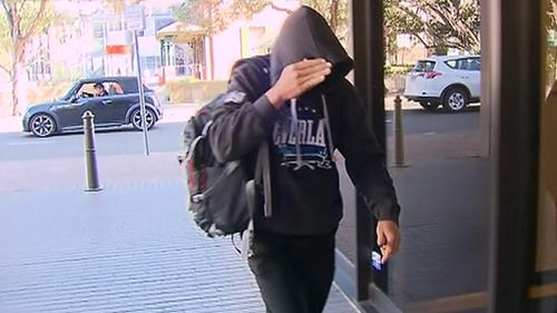 Benjamin Moorhouse tried to evade waiting media at court today. (9NEWS)