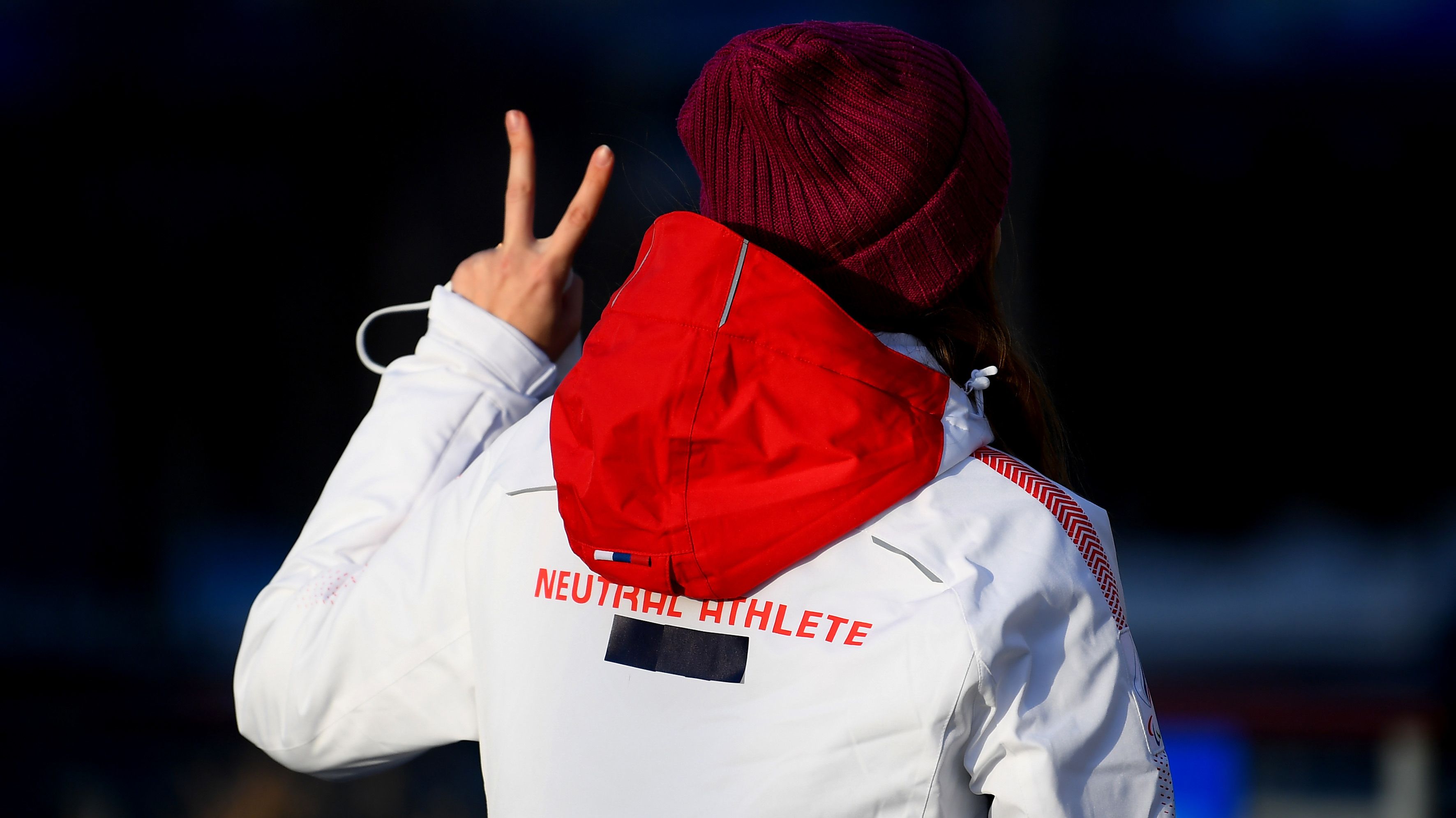 An athlete in a &#x27;Neutral Athlete&#x27; jacket at the 2022 Beijing Winter Olympics.