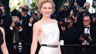 Kidman dressed in Chanel, wearing a gorgeous sequined white dress with a black and white ruffle hemline cinched in at the waist was finished with a bejewelled belt.