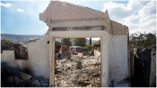 Hundreds of properties have been destroyed by the fire. (AFP)