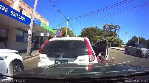 The driver struggled to get back on his feet and then accused the car behind of causing the crash. (Dash Cam Owners Australia)