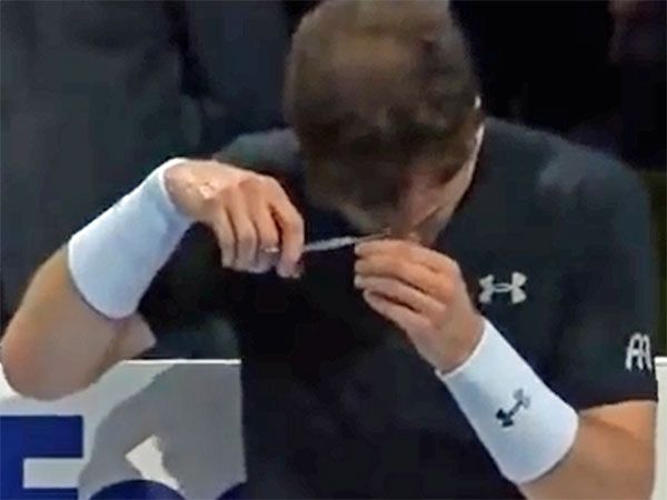 Andy Murray cuts his own hair during a match against Rafael Nadal. (Supplied)